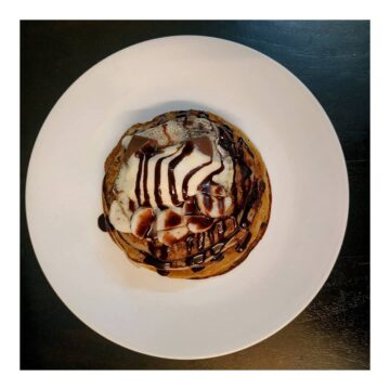 Amrita Jaiswal @amrita jaiswal1 Banana Pancakes topped with Chocolate Syrup and Vanilla