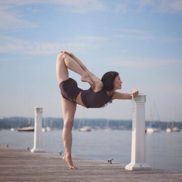 Elena Day 8 of SummerAlo2 YogaChallenge is a balance on